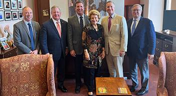 Debbie Stabenow standing with co-chairs of the Specialty Crop Farm Bill Alliance
